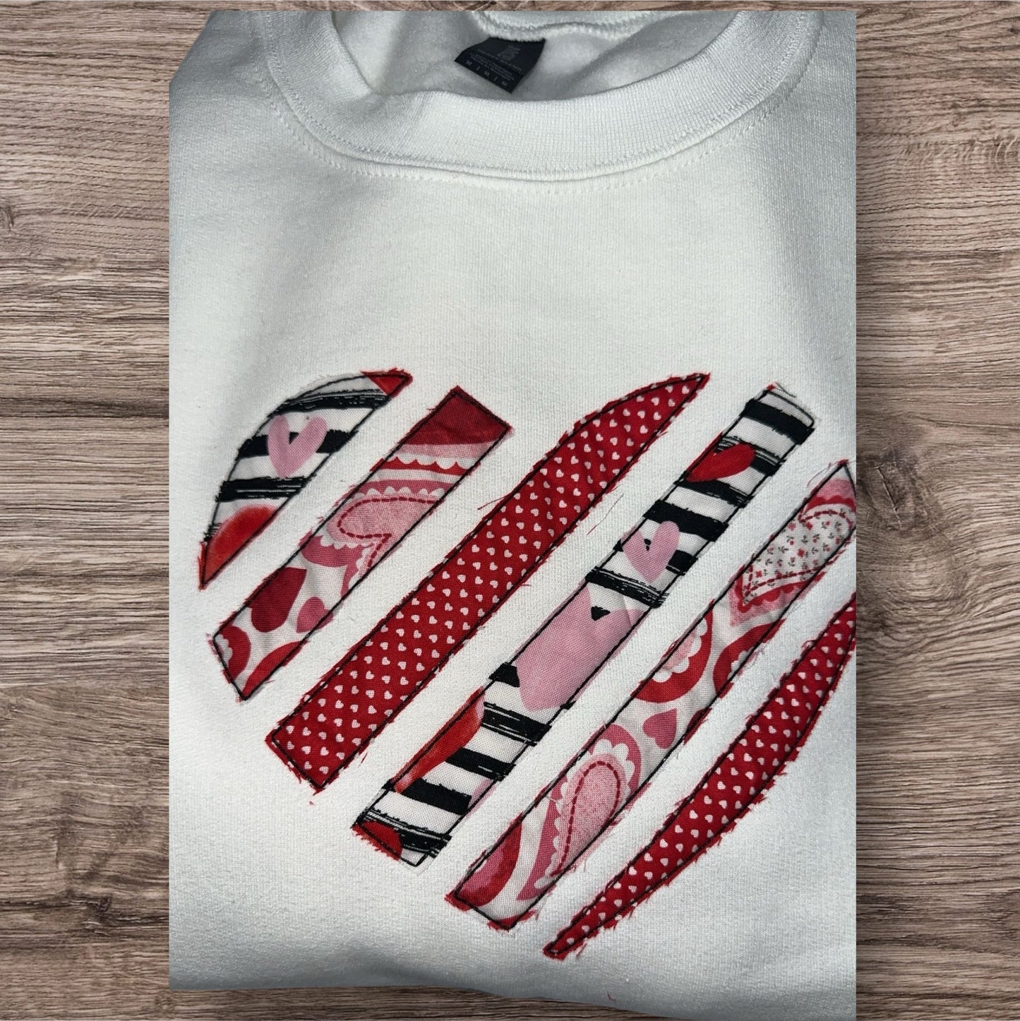 Heart applique embroidered crewneck sweatshirt